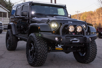 2014 Jeep Wrangler Unlimited Rubicon Black High Front Driver Side View