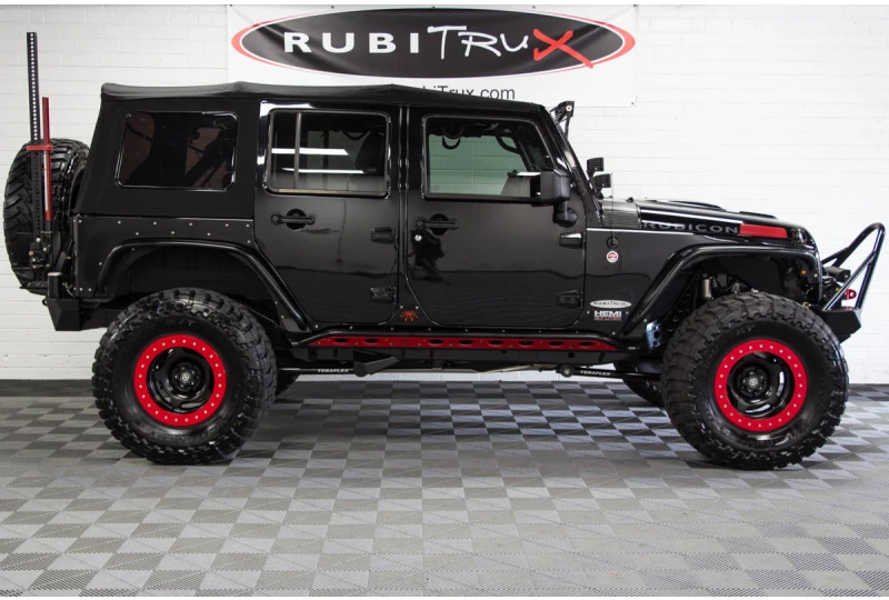 https://d1ducb2okbhmxx.cloudfront.net/catalog/product/cache/54b31fb065306593c364f8dcec4420b3/2/0/2012-custom-jeep-wrangler-rubicon-jk-jku-unlimited-black-5-7-hemi-conversion-poison-spyder-teraflex-dynatrac-mopar-rigid-industries-psc-steering-passenger-side.webp