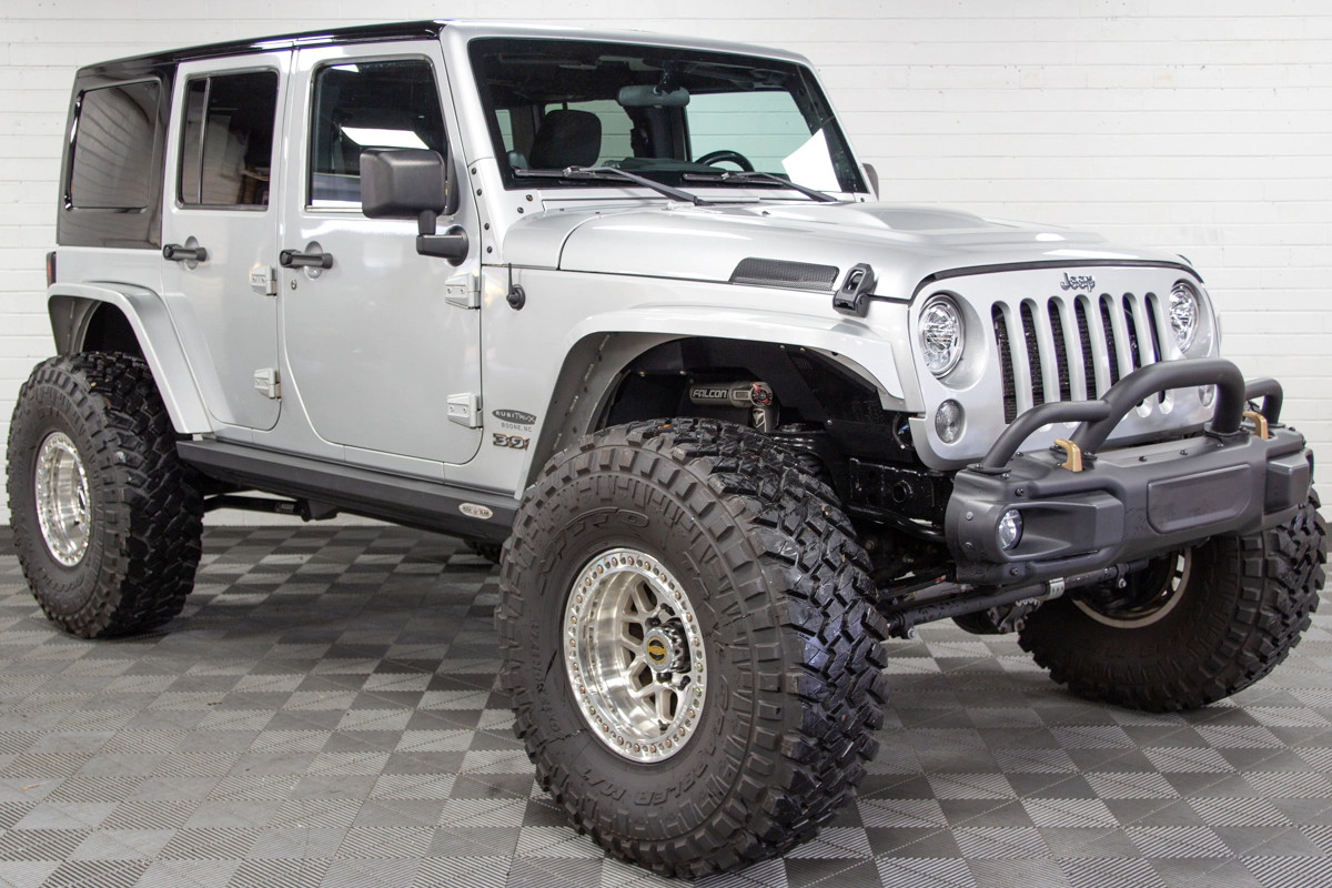 silver lifted Jeep JK with TeraFlex Long Arm kit install